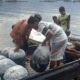 Petani di Danau Maninjau sedang memanen ikan miliknya