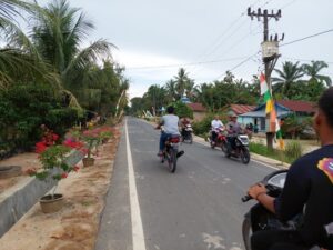 Jalan utama dari Desa Bandar Pulau menuju Desa Gonting Malaha, Kabupaten Asahan kini sudah diaspal di bawah pemerintahan Presiden Joko Widodo. (Foto: Dok. Istimewa)